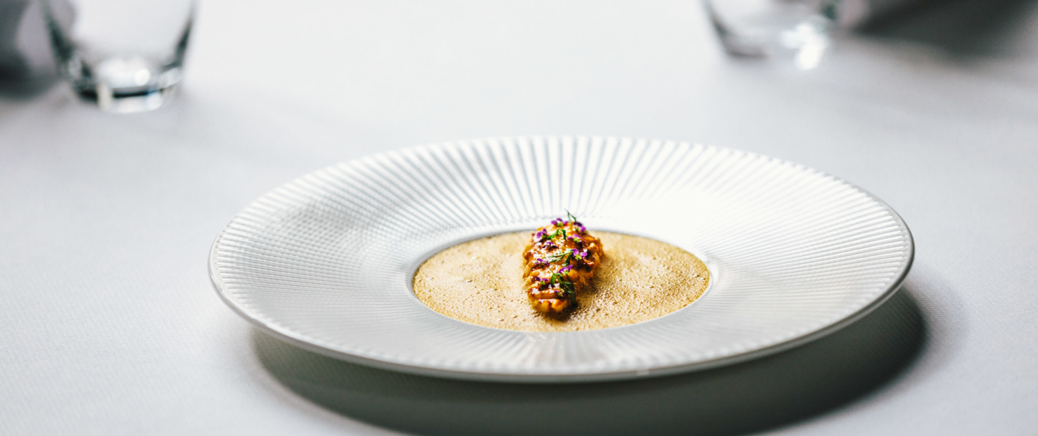 Langoustine with l'american sauce dish at 2 Michelin Star Restaurant Vinkeles, in luxury boutique hotel The Dylan Amsterdam, member of the Leading Hotels of the World.