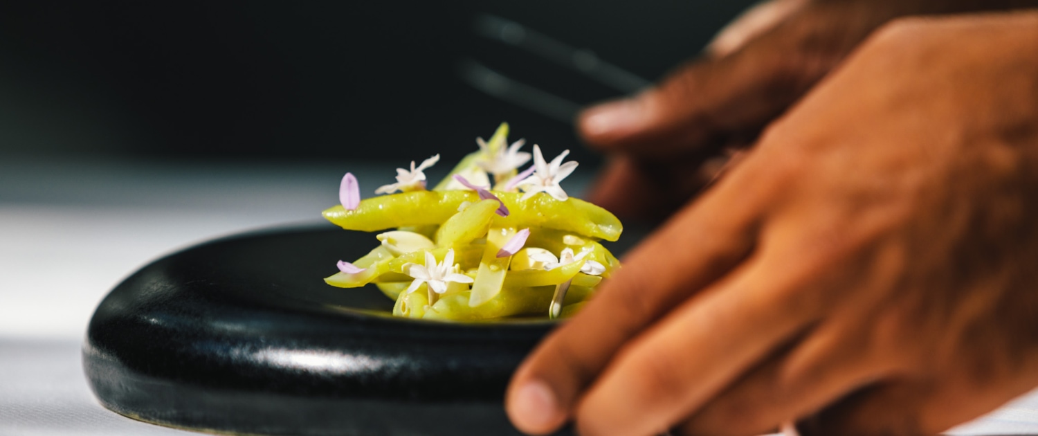 Yellow wax beans, a dish at 2 Michelin Star Restaurant Vinkeles, in luxury boutique hotel The Dylan Amsterdam, member of the Leading Hotels of the World.