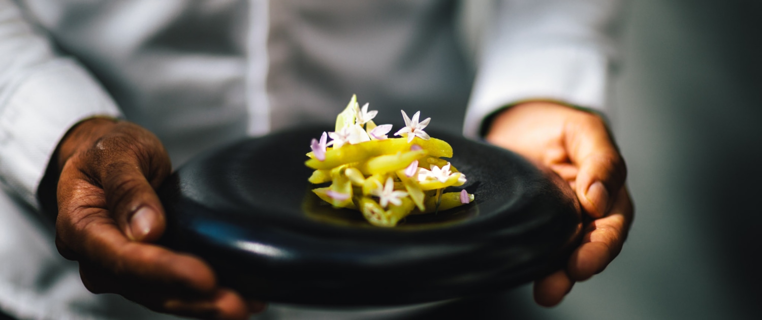 Yellow wax beans, a dish at 2 Michelin Star Restaurant Vinkeles, in luxury boutique hotel The Dylan Amsterdam, member of the Leading Hotels of the World.